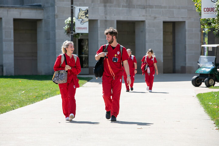 Two IU Kokomo nursing students walking outside.